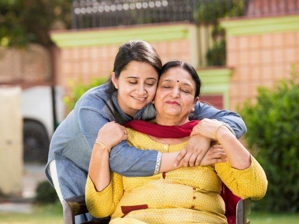 Daughter hugging mother 