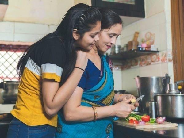 Daughter and mother in kitchen 