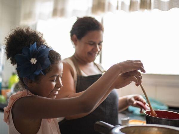 Mother and daughter cooking 