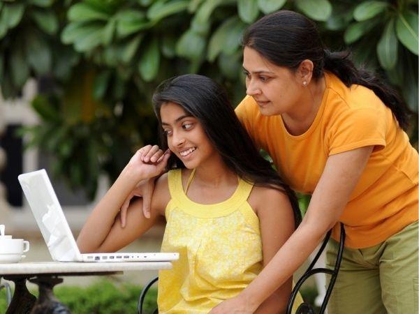 Mother daughter on laptop 