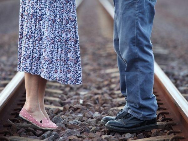 Couple on railway tracks 