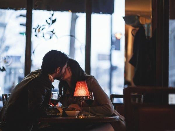 Couple kissing in candlelight 