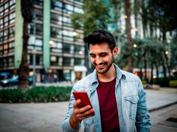 Indian man looking at his phone 