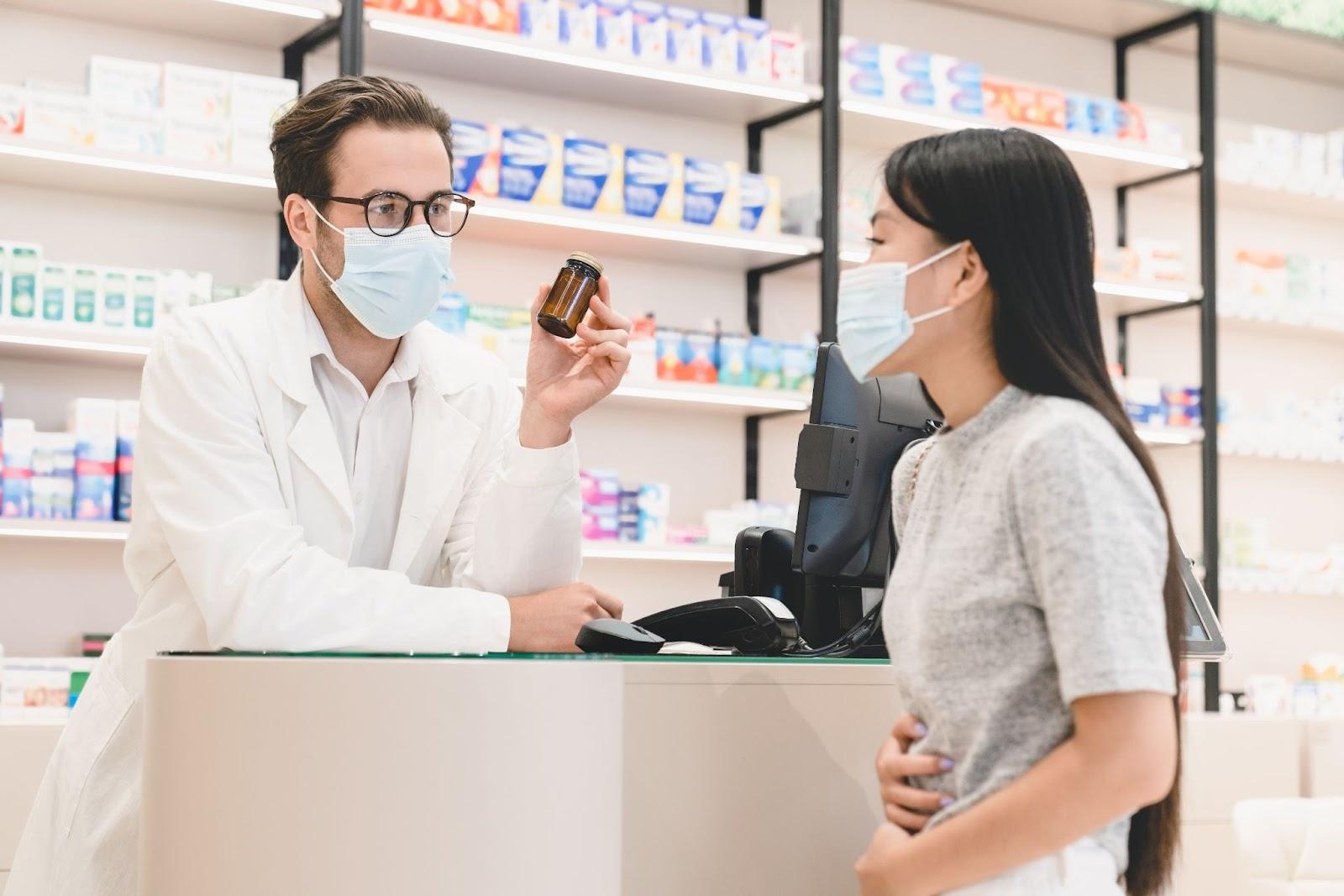 Woman consulting pharmcist for loose motions medication adjustment