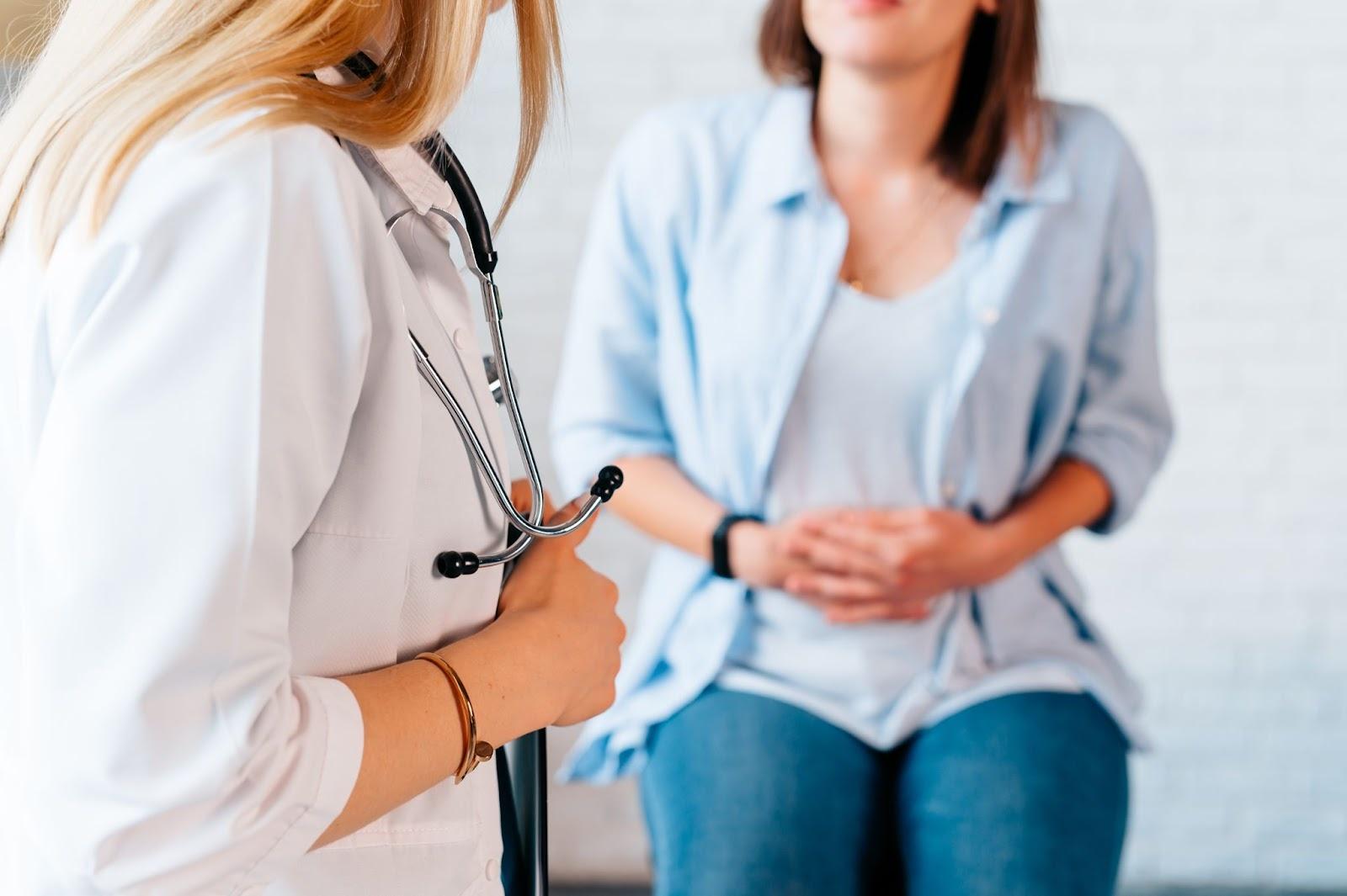 Woman suffering from loose motion consulting the doctor