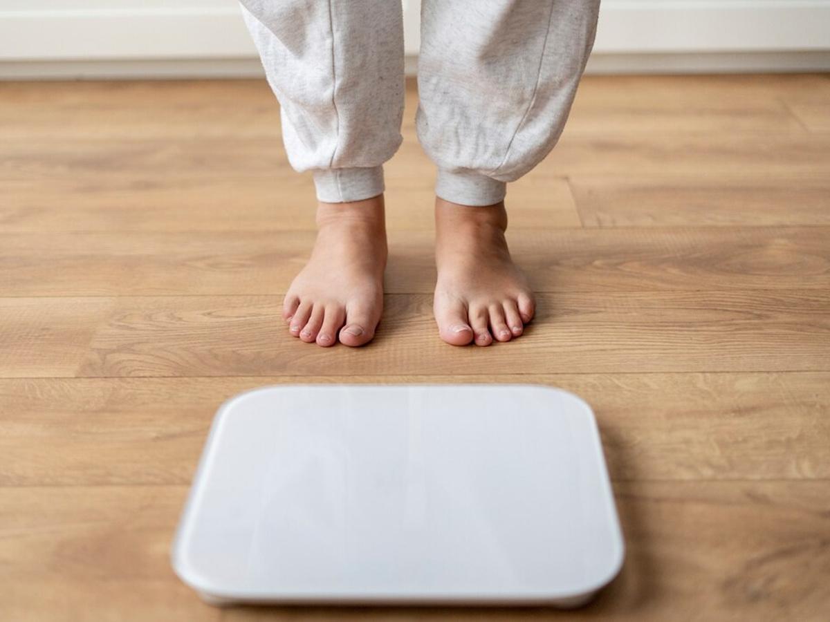 Woman checking weight