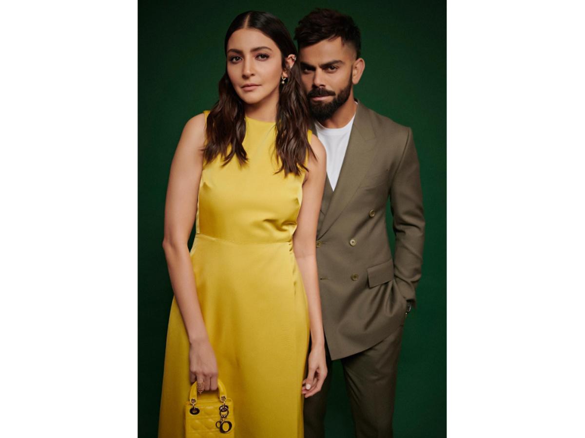 Virat Kohli and Anushka Sharma pose for an event,