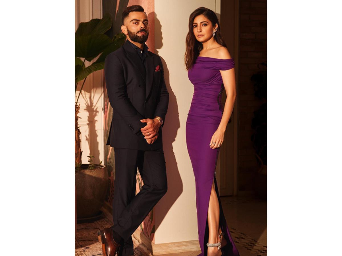 Virat Kohli and Anushka Sharma pose for an event, 