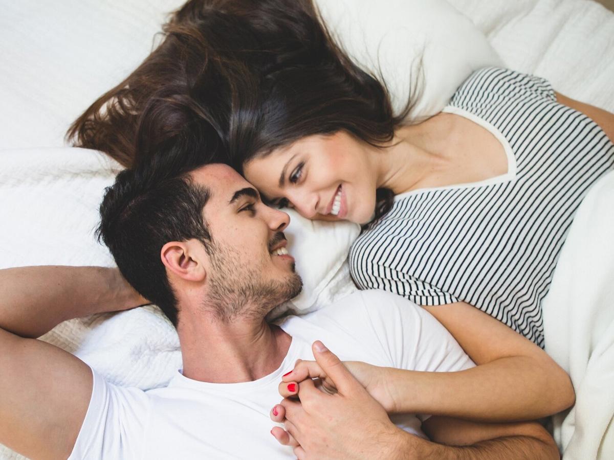 Couple in bedroom, 